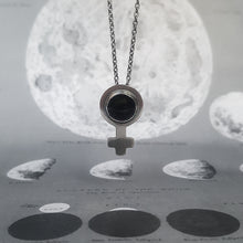 Load image into Gallery viewer, Feminist symbol necklace in silver, with a round onyx. On a background of the moon.