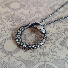 Load image into Gallery viewer, Ouroboros snake necklace, close up of pendant and chain.