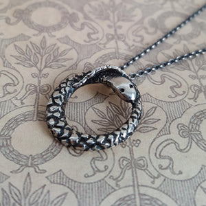 Ouroboros snake necklace, close up of pendant and chain.