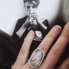 Load image into Gallery viewer, Statement silver ring with a Ziggy Stardust lightning in an oval shape.